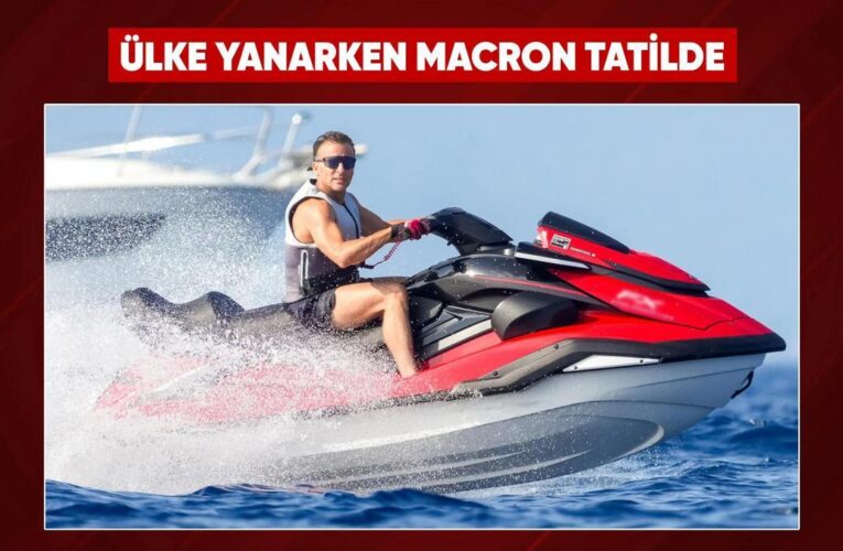 Fransa yanarken Macron jet ski üstünde